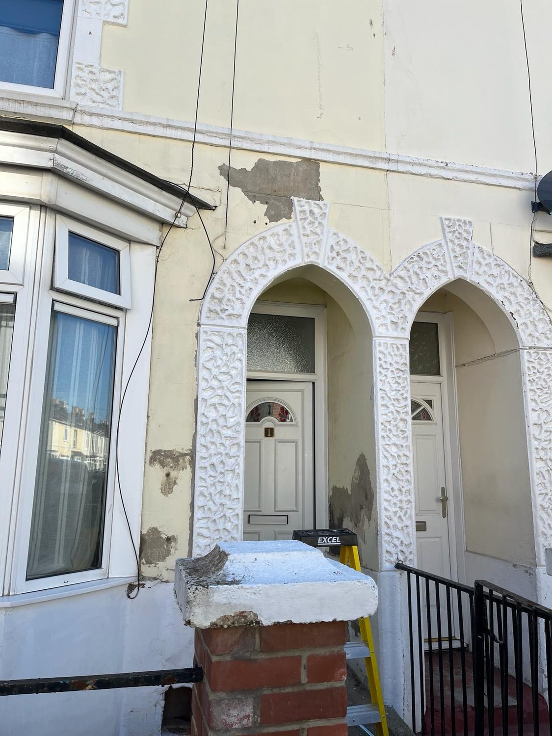 Render repair & exterior repaint - before